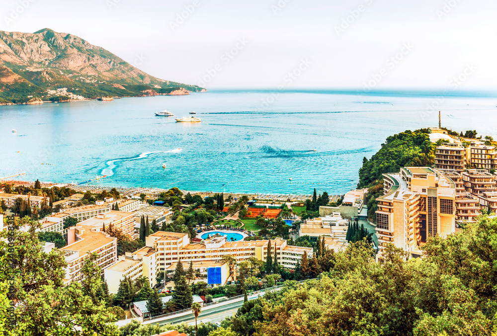 View of the hotels and the crowded beaches of the resort town of Becici, Budva Riviera, Montenegro.