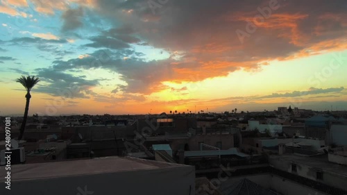 Amazing sunrise time laps over the rooftops of Marrakesh and the Attlas mountains photo