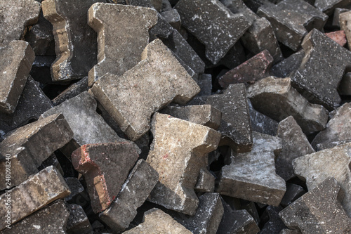 Pile of old discarded pavement (segmental paver) cobble stones. © Lubo Ivanko