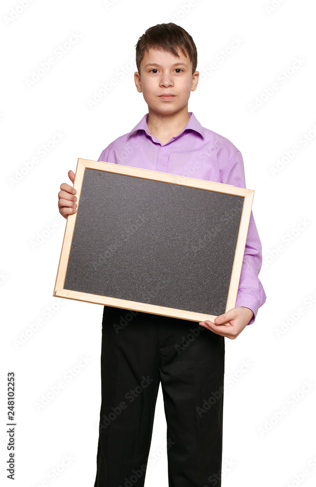 Boy posing on white background, black trousers and purple shirt Boy posing on white background, black trousers and purple shirt