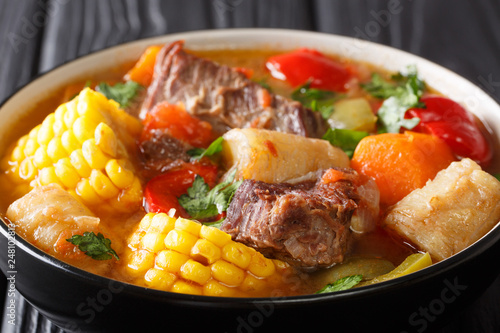 Sancocho is a traditional soup that is popular in several Latin American countries and which beef and vegetables close-up on a bowl. horizontal photo