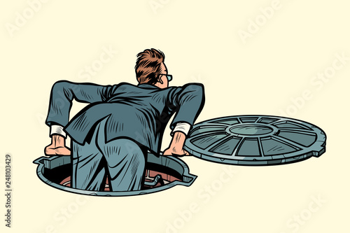 the sewer manhole. businessman climbs up
