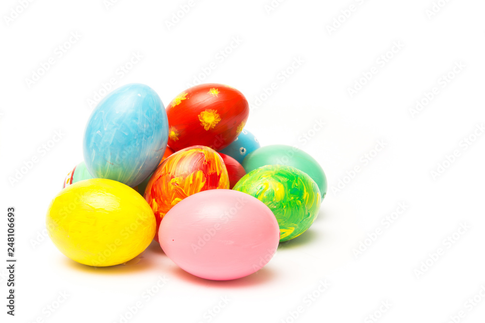 Easter background with handmade colored eggs. Festive tradition on white backdrop Easter background with handmade colored eggs. Festive tradition on white backdrop