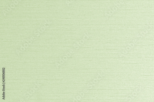 Cotton linen woven fabric texture background in light pale lime green color