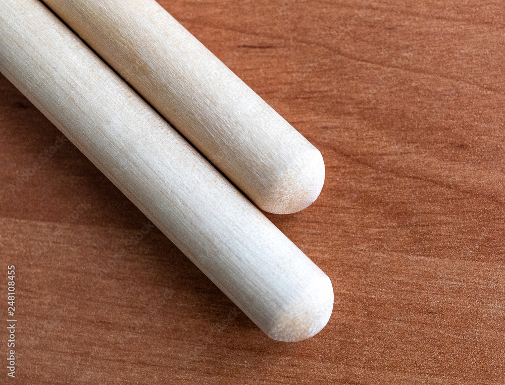 Two wooden drumsticks isolated on black background Two wooden drumsticks isolated on black background
