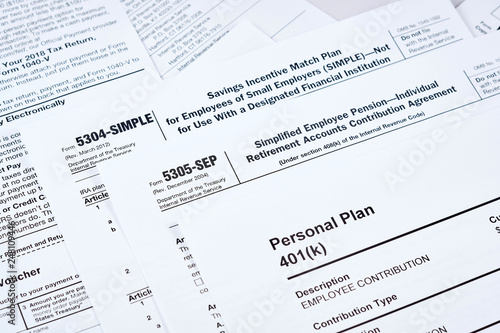 Tax reporting and retirement plan. Personal plan 401k form on against background 5304-simple, 53050-sep tax form and other forms