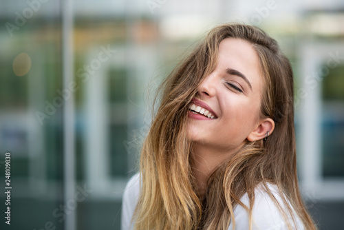 Cheerful carefree model with her eyes closed