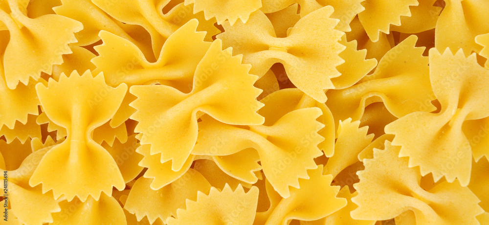 Farfalle pasta background also know as bow tie pasta and butterfly pasta Farfalle pasta background also know as bow tie pasta and butterfly pasta