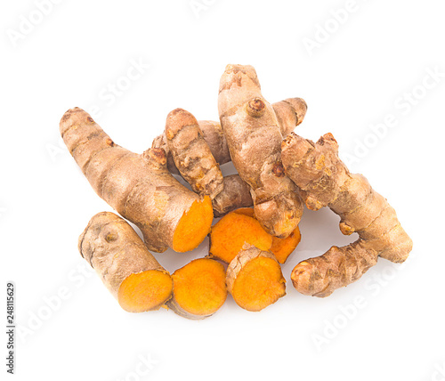 turmeric root and slices isolated on white top view