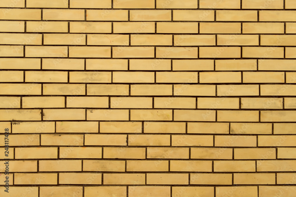 Yellow brick wall background Yellow brick wall background