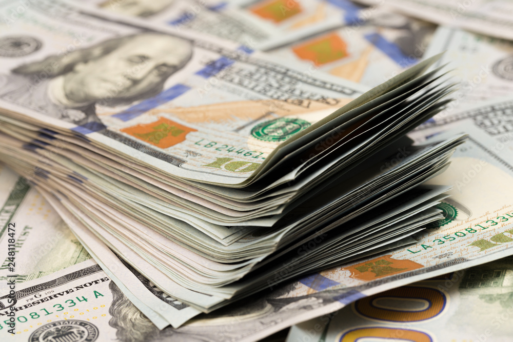 Stack of one hundred dollar bills close-up. Stack of one hundred dollar bills close-up.