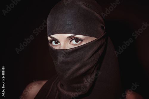 beautiful Oriental girl with almond eyes in hijab