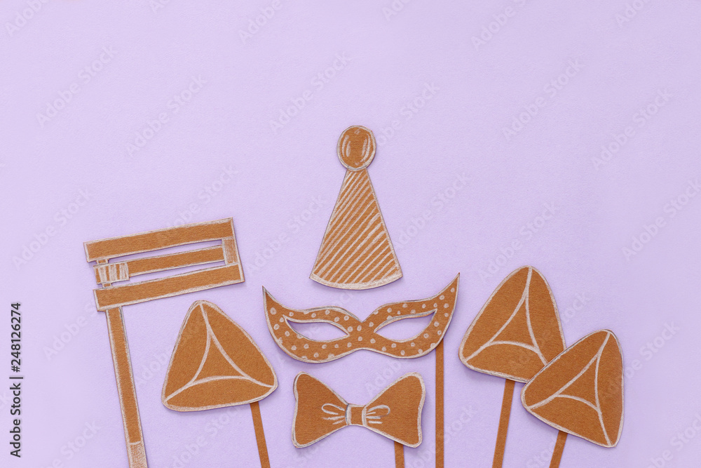 Purim celebration concept (jewish carnival holiday). Traditional symbols shapes cutted from paper. Purim celebration concept (jewish carnival holiday). Traditional symbols shapes cutted from paper.