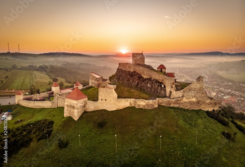 Fotografering Rupea citadel at sunrise in Transylvania tourist travel attraction situated betw