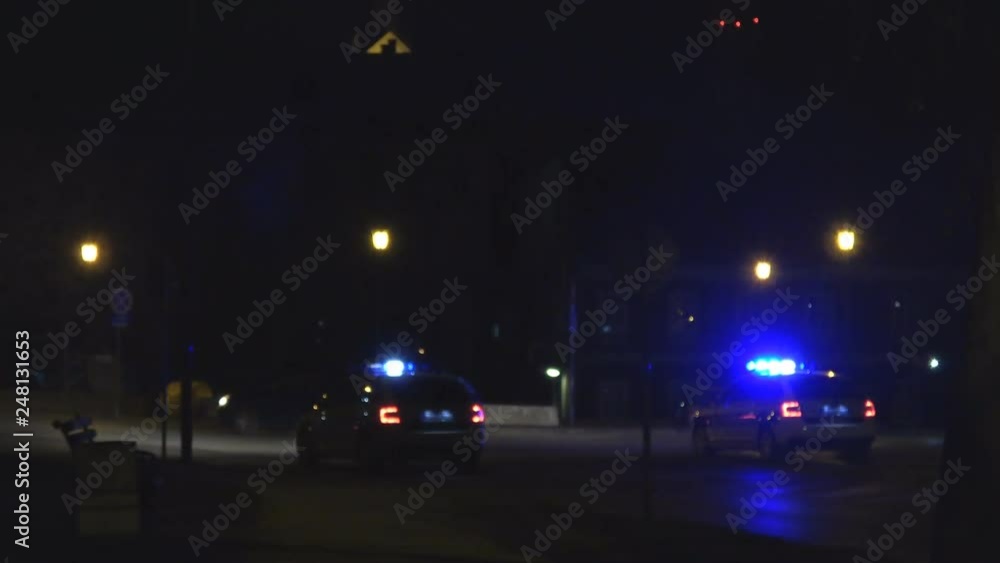 Police lights bokeh out of focus flashing at night city Police lights bokeh out of focus flashing at night city