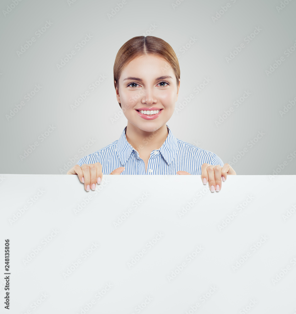 Happy businesswoman holding white empty signboard paper card background. Young woman smiling, business and education concept Happy businesswoman holding white empty signboard paper card background. Young woman smiling, business and education concept