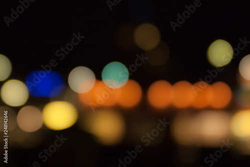 Blurred photo of defocused bokeh colorful lights. © Elena Noeva