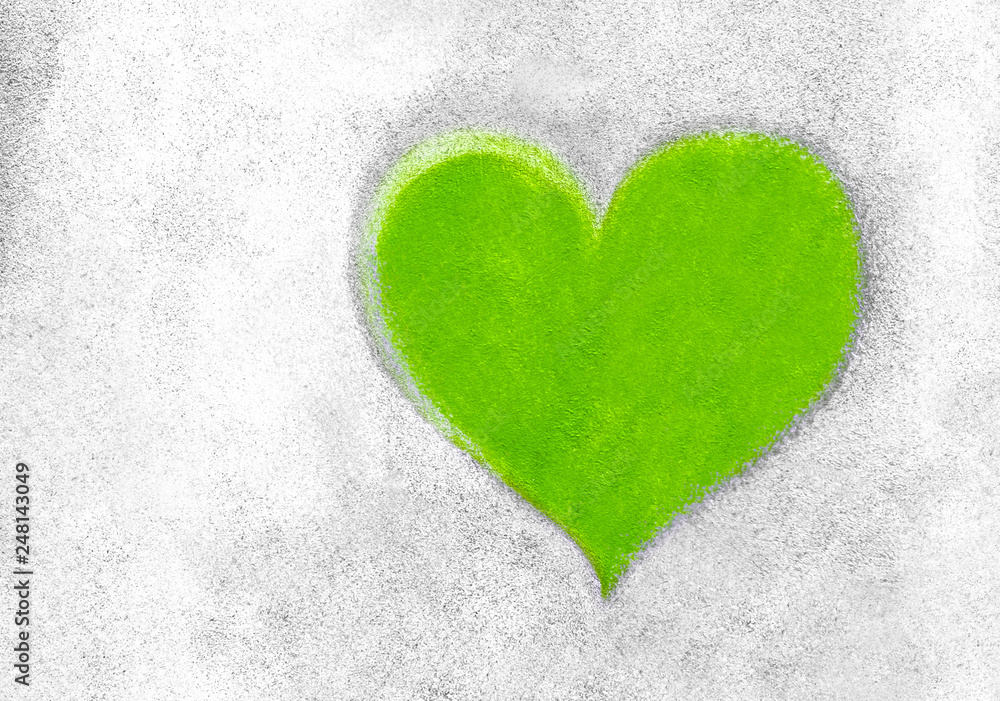 Green heart on concrete wall