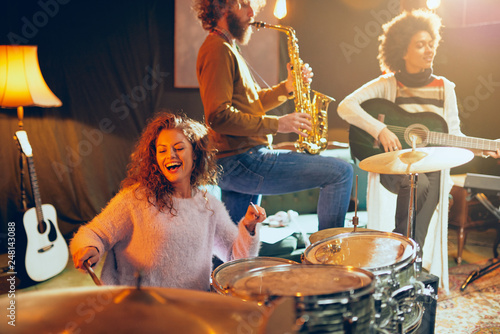 Photography Multicultural jazz band practicing for the gig in home studio.