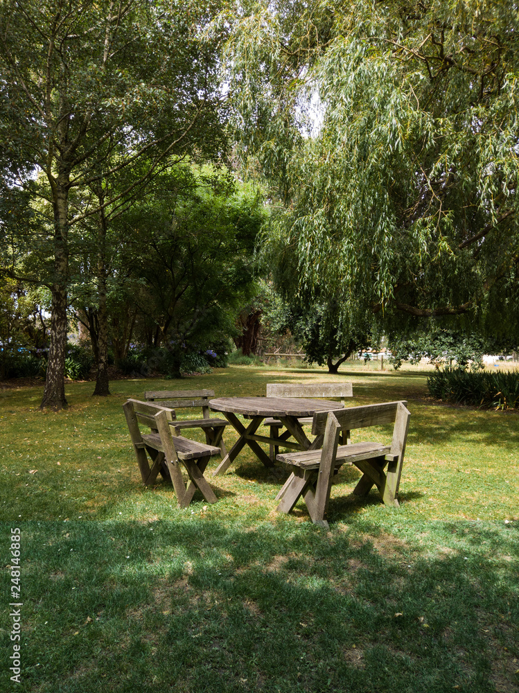 Empty chairs and table in the park.