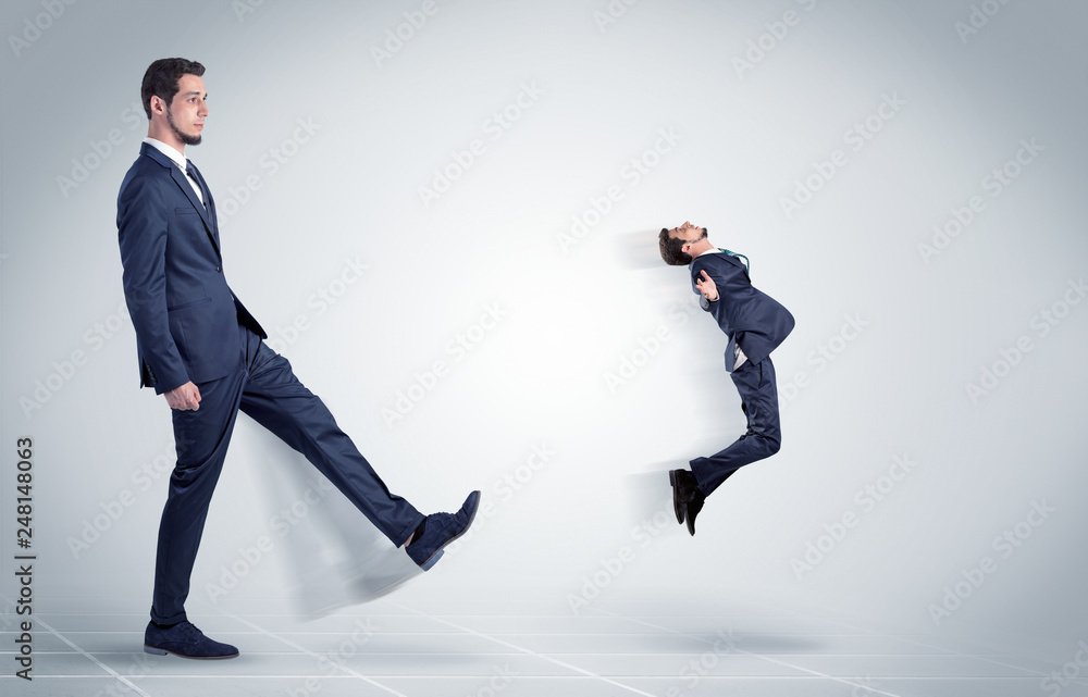 Young businessman fired cruel and aggressive by his boss with white background

