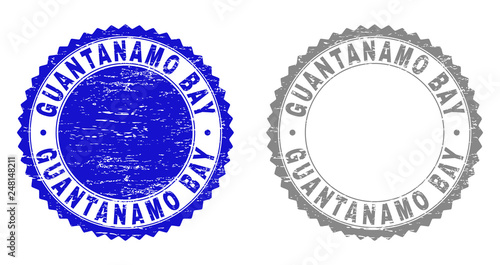 Grunge GUANTANAMO BAY stamp seals isolated on a white background. Rosette seals with grunge texture in blue and gray colors. Vector rubber overlay of GUANTANAMO BAY label inside round rosette. photo