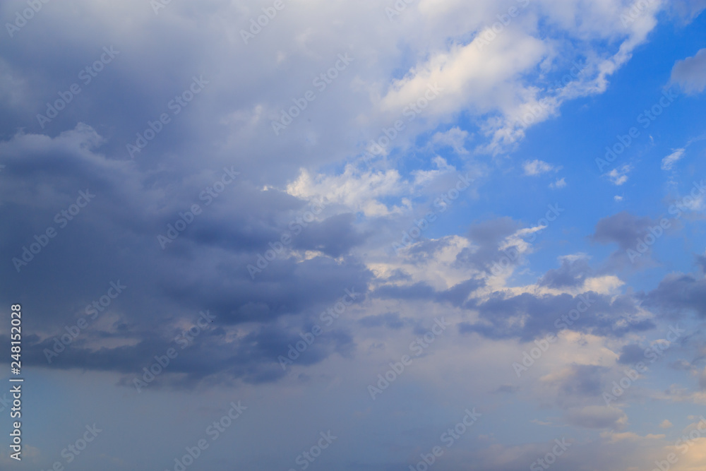 Fototapeta premium Clouds after rain before sunset as a background