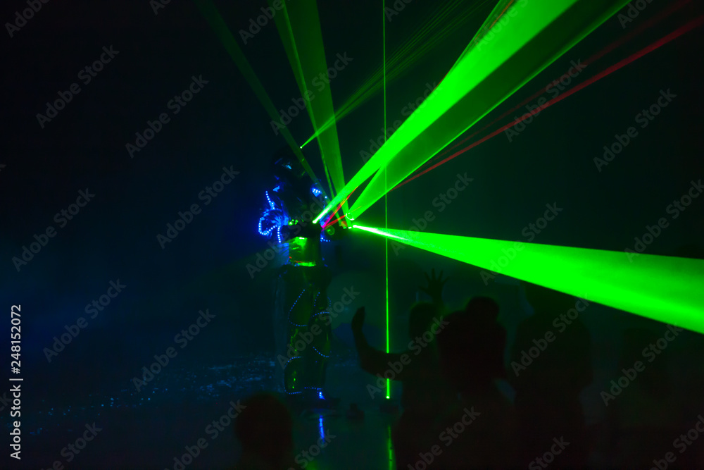 Obraz premium Colorful lights show. Laser show in motion in dark