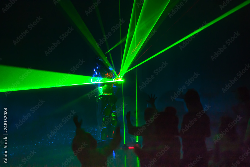 Obraz premium Colorful lights show. Laser show in motion in dark