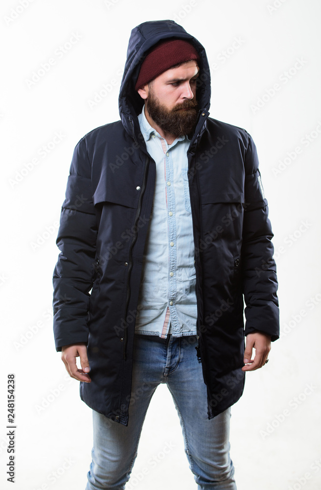 Hipster outfit. Man bearded hipster stand in warm black jacket parka isolated on white. Hipster modern fashion. Guy wear hat and black winter jacket. Stylish and comfortable. Hipster style menswear Hipster outfit. Man bearded hipster stand in warm black jacket parka isolated on white. Hipster modern fashion. Guy wear hat and black winter jacket. Stylish and comfortable. Hipster style menswear