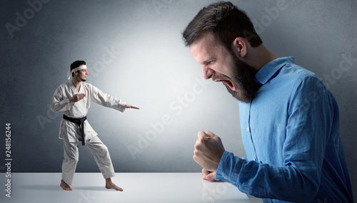 Giant hipster man yelling at a small karate man