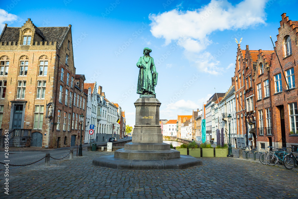Bruges, Belgium - August 17, 2017: Statue of the Flemish painter Jan van Eyck in Bruges.