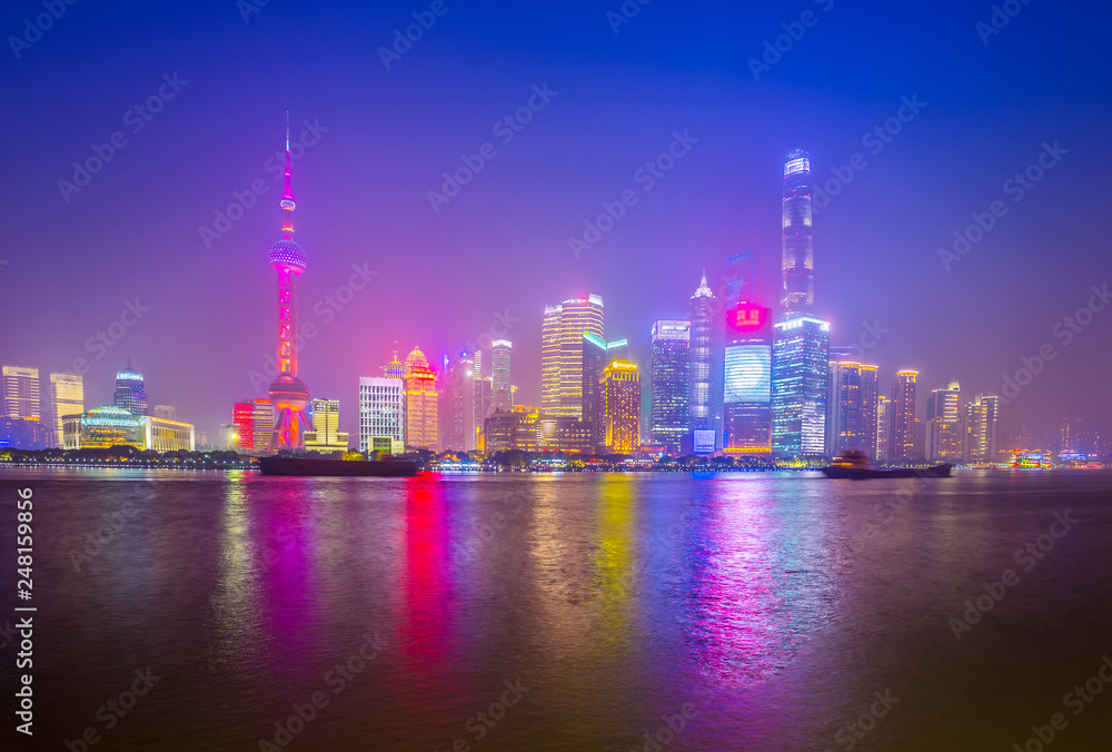 Shanghai by the Huangpu River on a foggy night, China city skyline