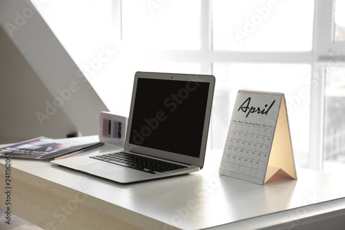 Flip calendar with laptop o...