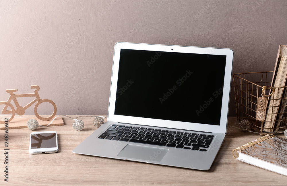 Comfortable workplace with modern laptop Comfortable workplace with modern laptop
