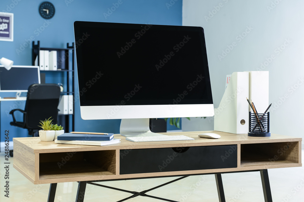 Comfortable workplace with modern computer in office Comfortable workplace with modern computer in office