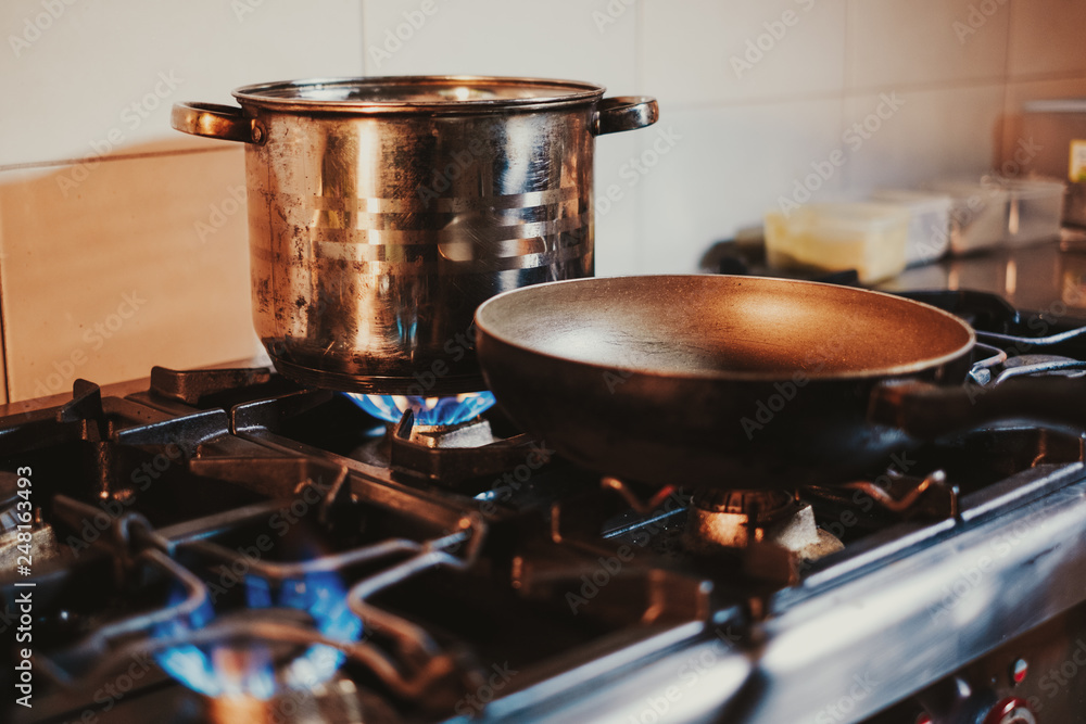 Frying pan heating on the kitchen stove Frying pan heating on the kitchen stove