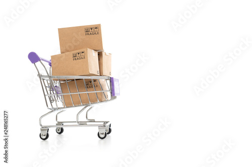 Paper boxes in a trolley on white background,Online shopping or ecommmerce concept
