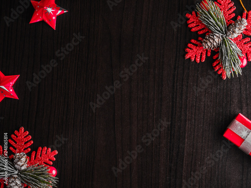 christmas background with decorations and gift boxes on wooden board