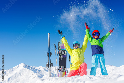 Skiing, winter, snow, sun and fun - kids, boy and girl having fun in the Alps. Child skiing in the mountains.