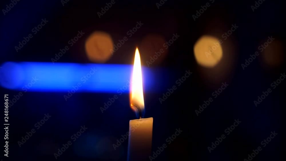 burning candle flame on black background close up burning candle flame on black background close up