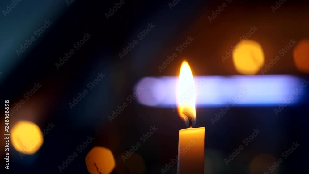 burning candle flame on black background close up burning candle flame on black background close up