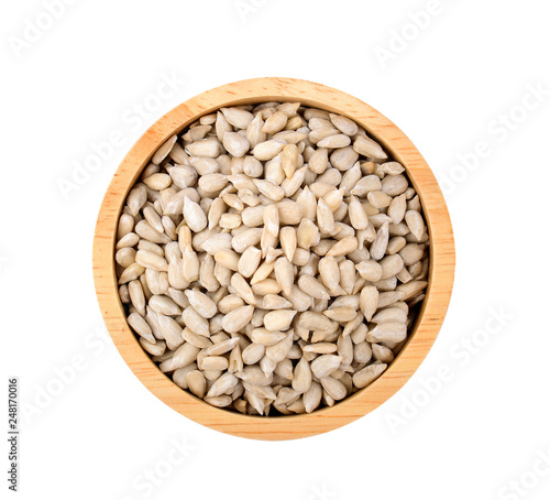 sunflower seeds in bowl on white background. photo