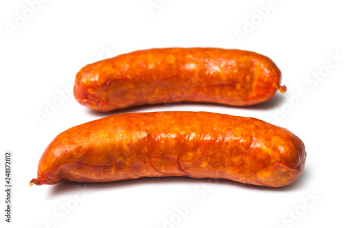 Closeup of smoked sausage on white background