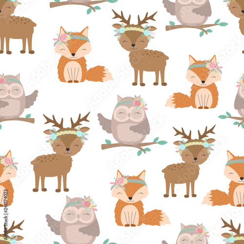 Fototapeta Naklejka Na Ścianę i Meble -  Seamless boho pattern. Vector image on national American motifs. Illustration of a little fox, deer and owl with feathers and flowers. For print, background, textile, holiday, children, baby, birthday