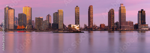 Long Island City panoramic view from east river at sunset with long exposure