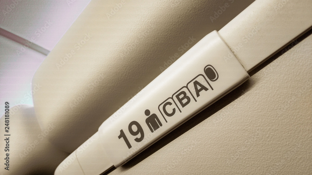 seat numbers on luggage shells inside the passenger airplane