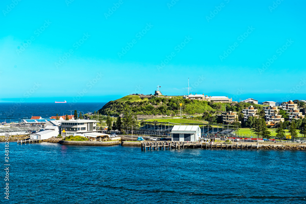 Ship passage past Fort Scratchley at Newcastle, New South Wales, Australia in its departure to the Tasman Sea