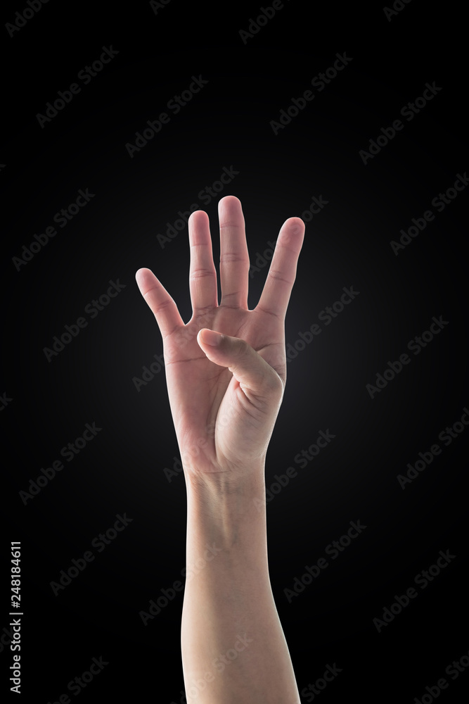 Hand up with four fingers of woman with rim light isolated on dark black background (clipping path) for number 4 Hand up with four fingers of woman with rim light isolated on dark black background (clipping path) for number 4