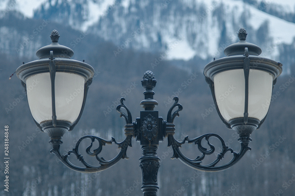Street lamps on the background of mountains